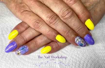 Light blues and yellow with flower nail art